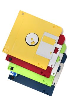 Pile of colorful computer floppy disks isolated on a white background.