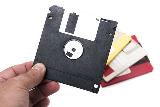 hand with floppy disk isolated on a white background.
