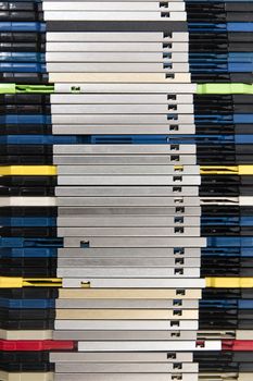 Vertical pile of computer floppy disks.