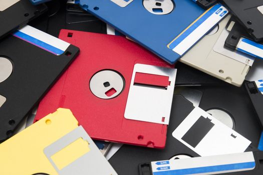 mixed pile of obselete computer floppy disks.