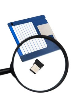 hand with magnifying glass inspecting on usb disk concept.