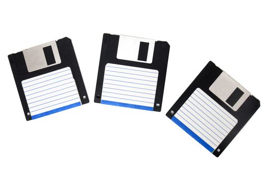 three computer floppy disks on a composition isolated on a white background.