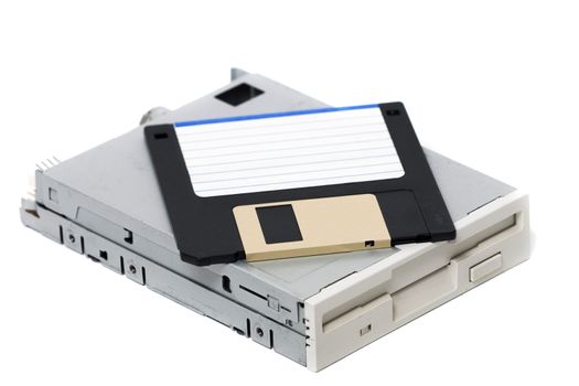 Closeup view of a computer floppy drive, isolated on a white background.