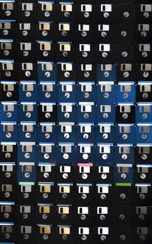 Full view of a background of many colorful floppy disks.