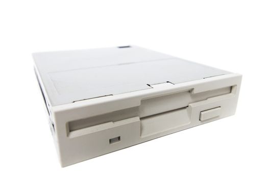 Closeup view of a computer floppy drive, isolated on a white background.