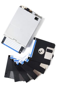 Closeup view of a computer floppy drive, isolated on a white background.