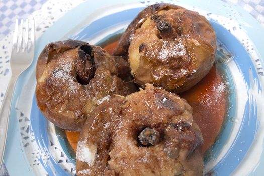 Oven baked apples with cinnamon, sugar honey and red wine.