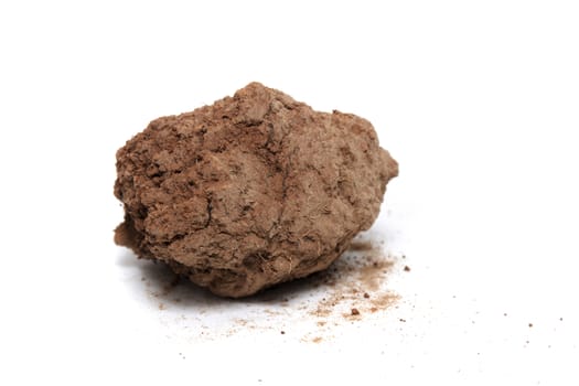red chunk of barren clay isolated on a white background.