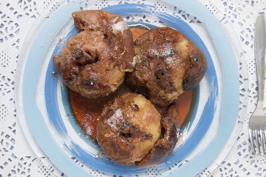 Oven baked apples with cinnamon, sugar honey and red wine.