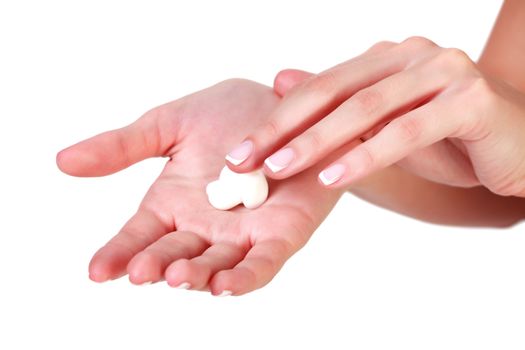 Closeup shot of beautiful woman's hands with cream, isolated on white background