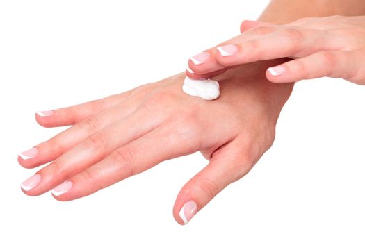 Closeup shot of beautiful woman's hands with cream, isolated on white background