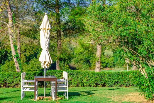 Outdoor dining area in holiday resort in Tuscany