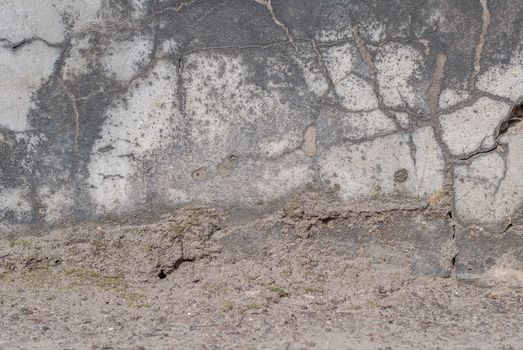 fragment of a concrete wall that for a long time exposed to different climatic conditions