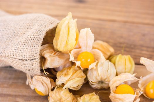 Cape gooseberry (Physalis) on old wooden, Healthy food