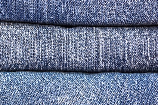 lot of denim blue jean texture is the classic indigo fashion. close-up of denim blue jeans, concept for fashion