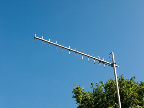 a metal aerial outside close up with blue sky in background for tv