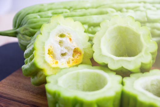 Fresh green bitter cucumber or chinese bitter melon or melon sliced in pieces 