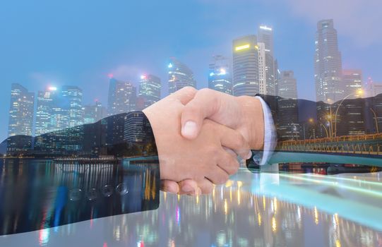 business handshake with city background, Double exposure style.