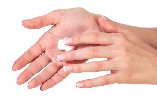 Closeup shot of beautiful woman's hands with cream, isolated on white background