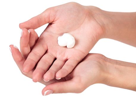 Closeup shot of beautiful woman's hands with cream, isolated on white background