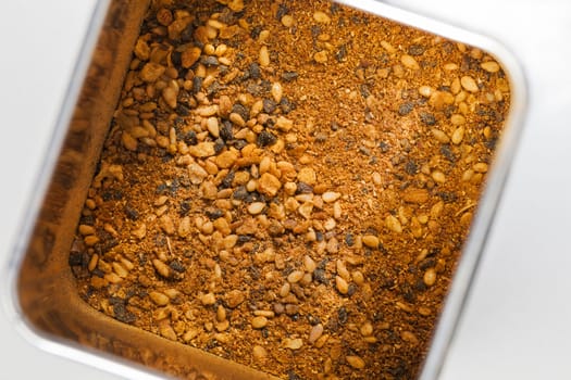 Shichimi togarashi spice mixture in a metal can seen from above