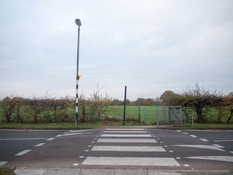 clear road zebra crossing road outside pole street lamp; essex; england; uk