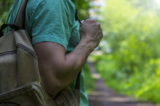 A man walks in the woods. A traveler, a tourist. Summer. Autumn.