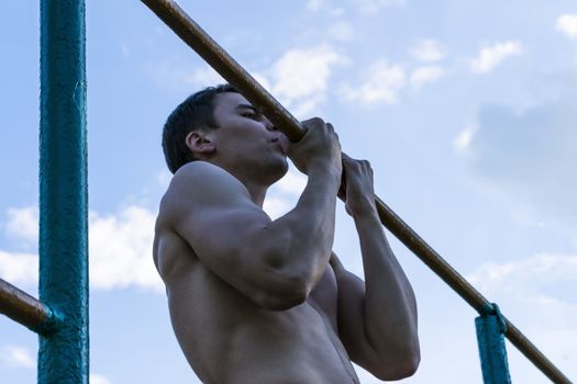 a young man on the bar