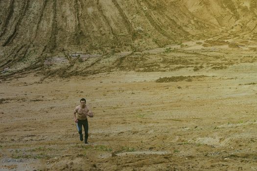 Young man running in the desert