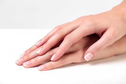 Closeup shot of beautiful woman's hands with clear and healthy skin