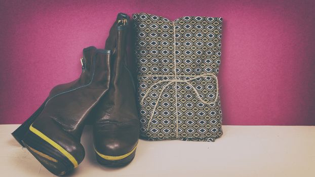 Ankle boots on a colored background