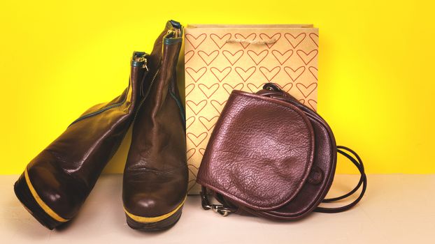 Women's shoes, handbag on a colored background