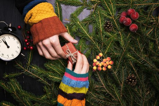 A man and a woman decorate the Christmas tree together. The view from the top.