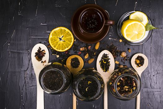 Tea in mugs and wooden spoons