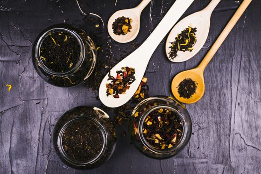 Tea in wooden spoons, lemon