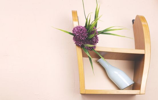 Vase and flower on the shelf