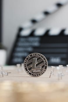 Digital currency physical metal litecoin coin. Cryptocurrency video concept.