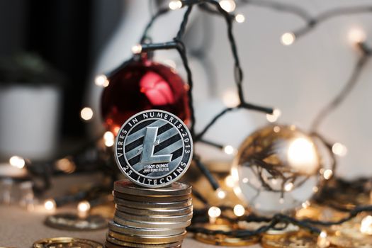 Digital currency physical silver metal litecoin coin. Christmas concept.