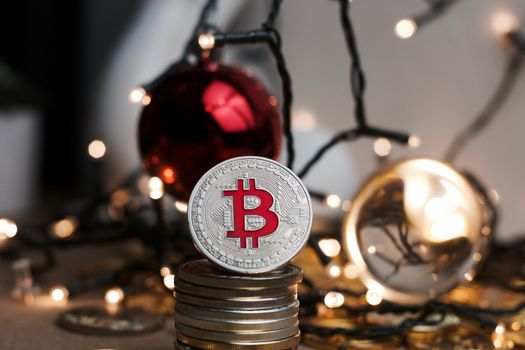 Crypto currency physical metal bitcoin coin. Digital currency christmas concept.