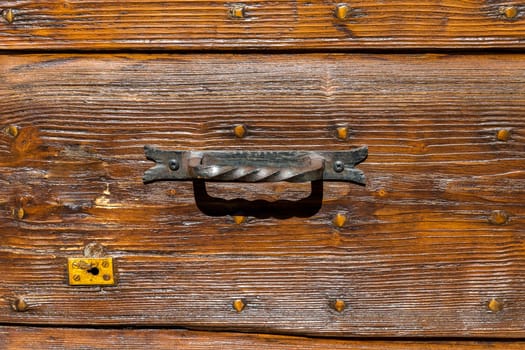 Close up of rustic old door in Spoleto, Italy.