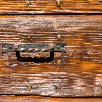 Close up of rustic old door in Spoleto, Italy.