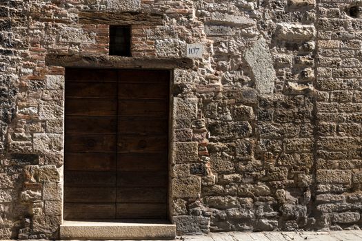 Gubbio (Italy): Old door on medieval stone wall