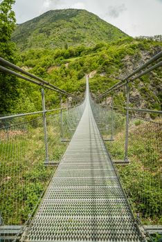 Footbridge over cliff and lake Monteynard in Isere in France