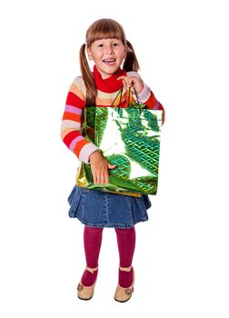 Smiling six years Girl holding presents bags isolated