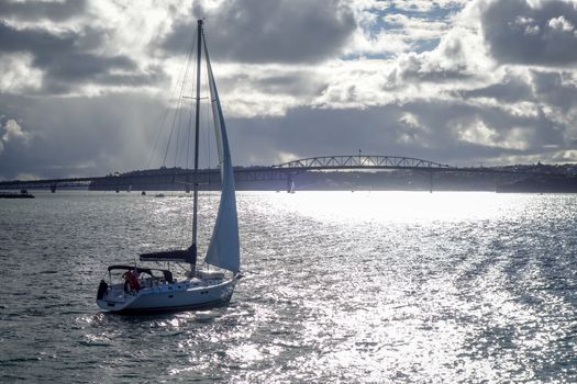 Auckland bridge and city center view from the sea and sailing ship, New Zealand