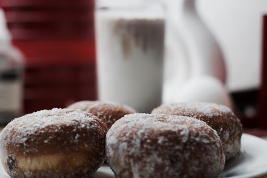 Delicious doughnuts on the white plate. Sweet fresh food concept.