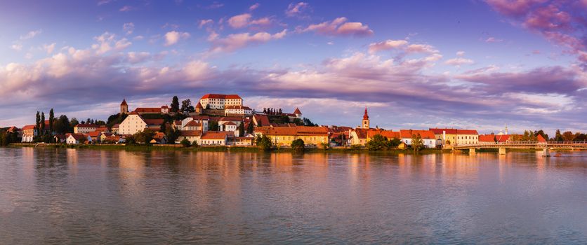 Ptuj, Slovenia, panoramic shot of oldest city in Slovenia with a castle overlooking the old town from a hill and the Drava river beneath