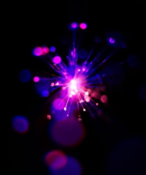 Colorful light explosion on black background. Futuristic wallpaper