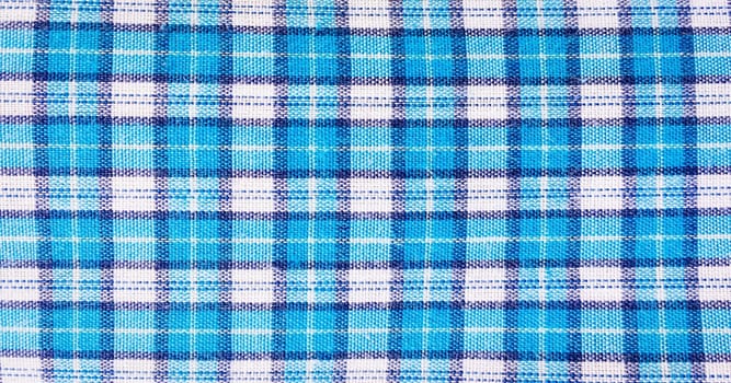 textile blue box, fabric blue plaid cover. Blue classic checkered pattern. blue checkered fabric closeup , tablecloth texture