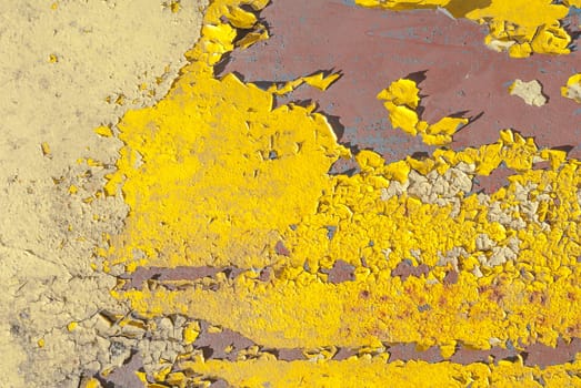 fragment of an iron surface is covered old paint, which has long been under the influence of different climatic conditions